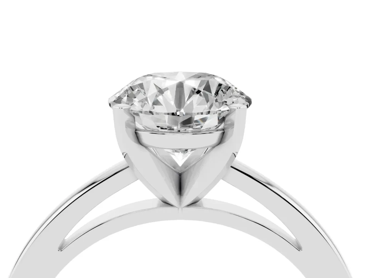 Round Cut Solitaire Diamond Engagement Ring with Four-Prong Setting on a Classic Band Silver