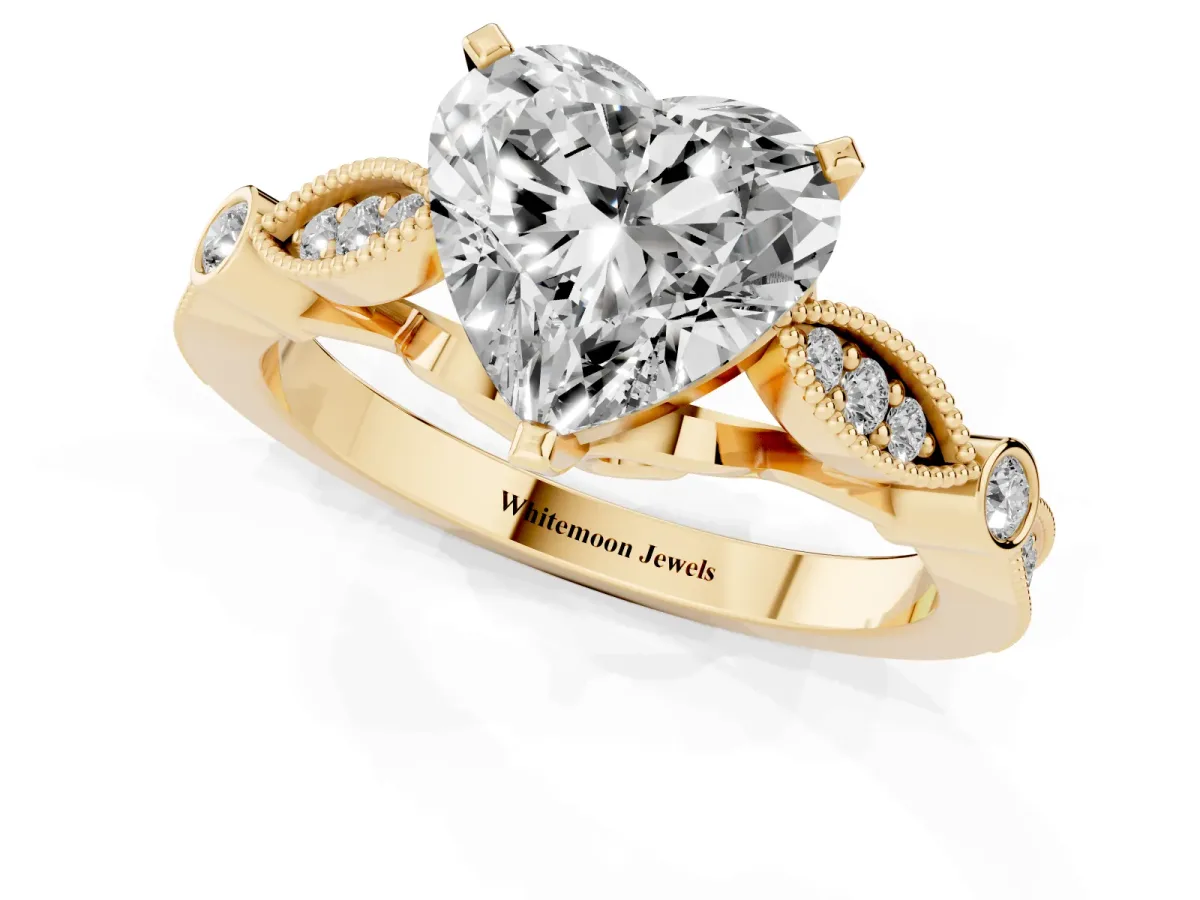 Heart Cut Cut Diamond with Milgrain Marquise and Bezel Accents on a Solitaire Band with Prong Setting Yellow gold