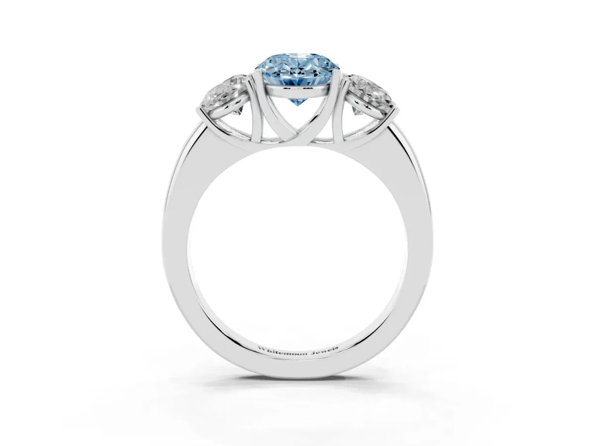 Fancy Blue Oval Cut Diamond Three-Stone Ring with Four-Prong Setting and Classic Band Platinum