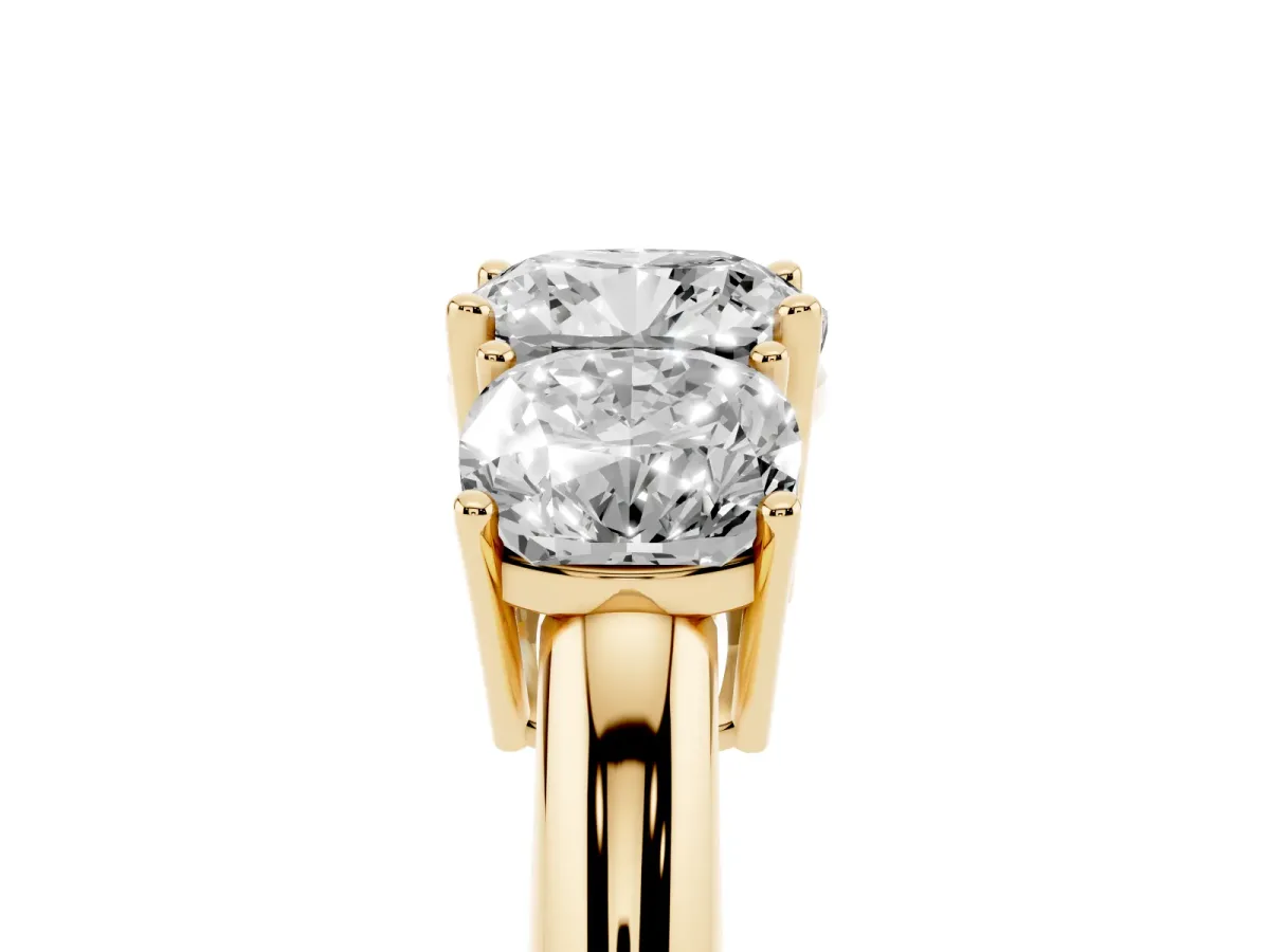 Three-Stone Cushion Cut Cut Diamond Engagement Ring with Prong Setting on a White Gold Band Yellow gold