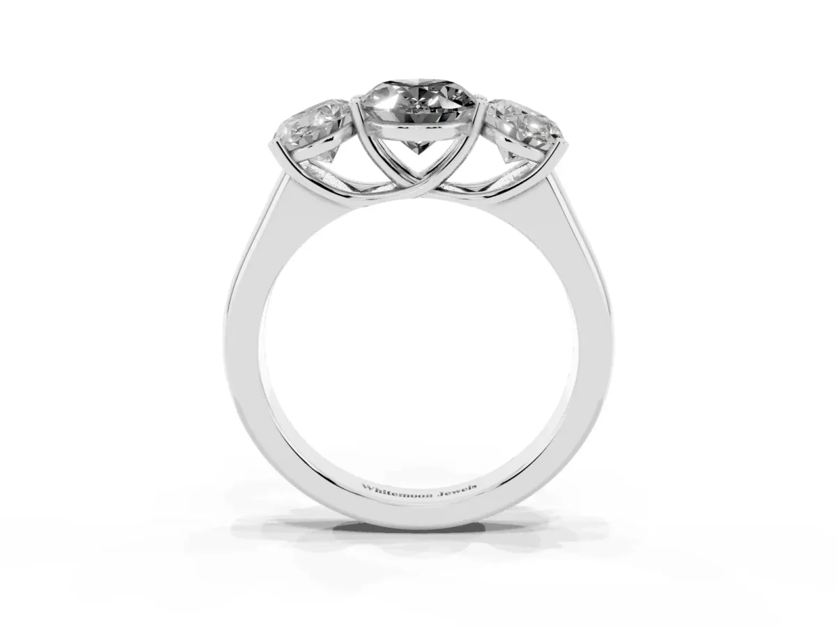 Fancy Black Oval Cut Three-Stone Diamond Ring with Prong Setting on a Classic Band Platinum