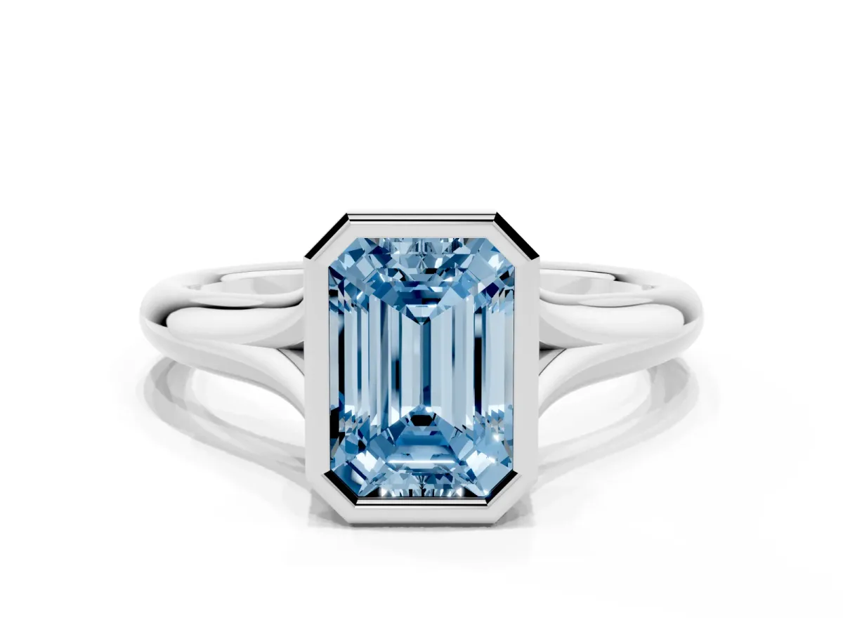 Fancy Blue Bezel Set Emerald Cut Solitaire Diamond Ring with Smooth Band Silver