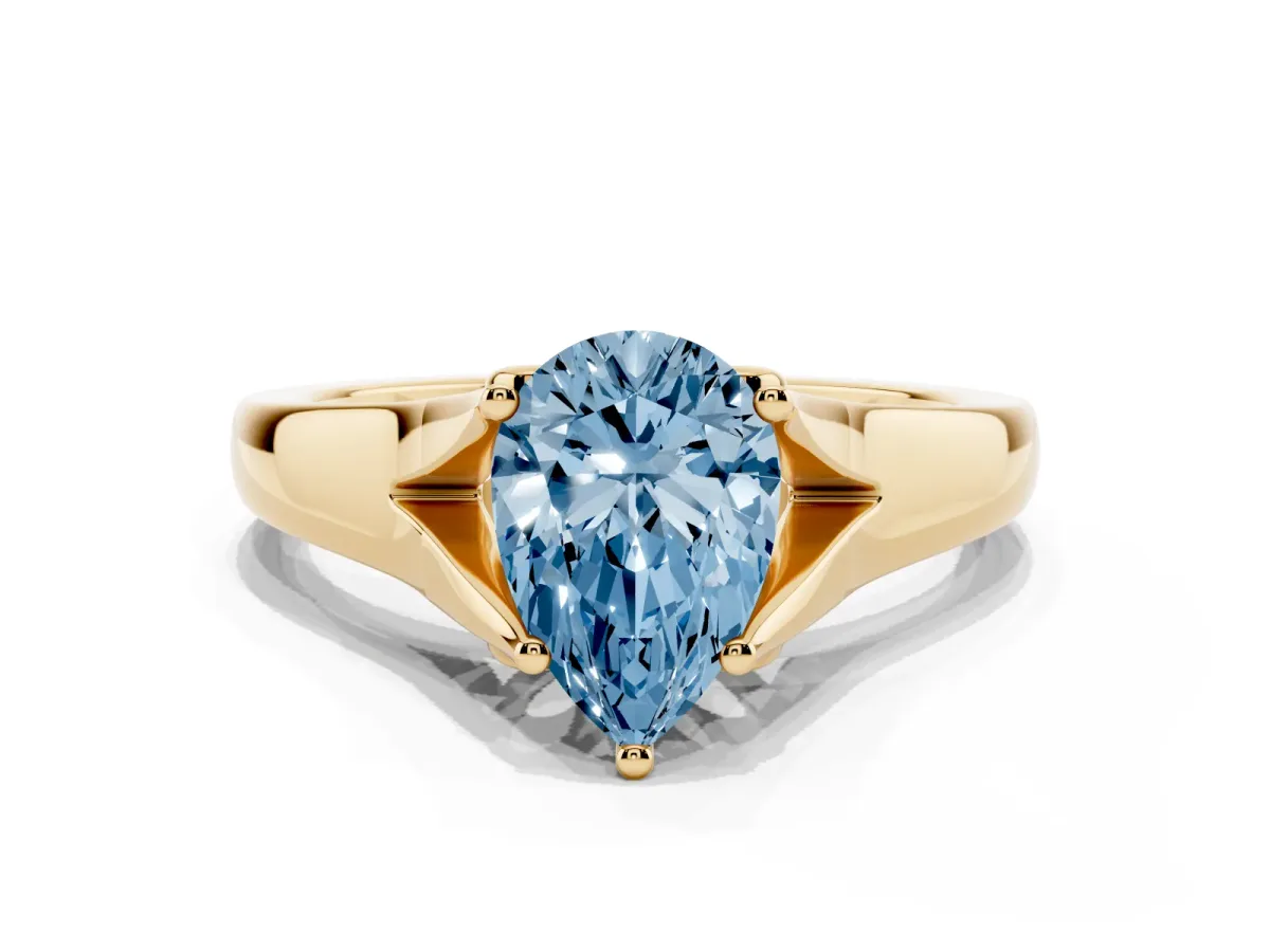 Fancy Blue Pear Cut Solitaire Diamond Ring with Cathedral Band and Four-Prong Setting Yellow gold