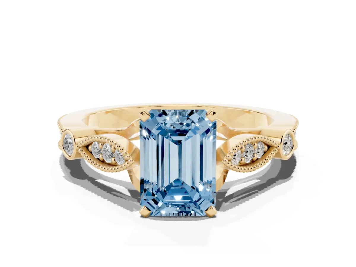 Fancy Blue Emerald Cut Cut Diamond with Milgrain Marquise and Bezel Accents on a Solitaire Band with Prong Setting Yellow gold