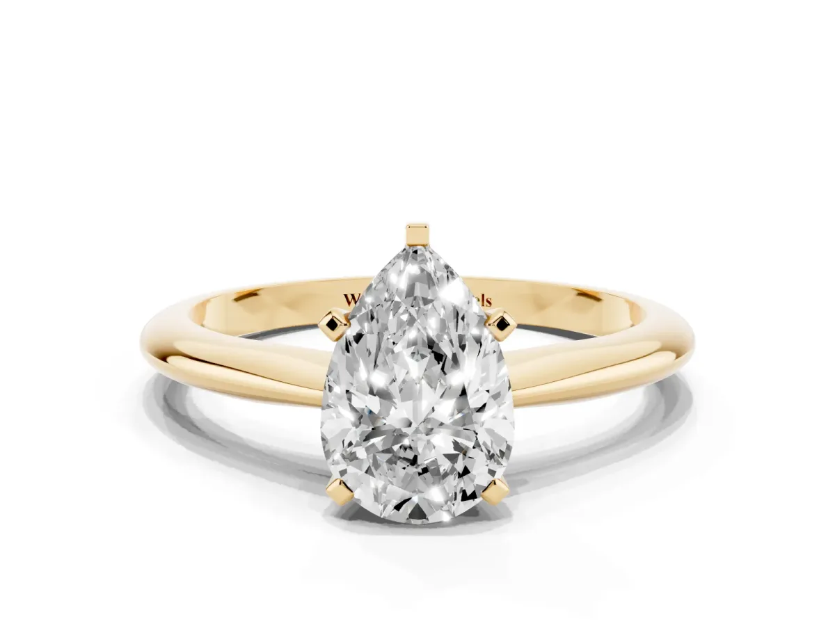 Pear Cut Cut Solitaire Ring with Four-Prong Setting on a Classic Band Yellow gold