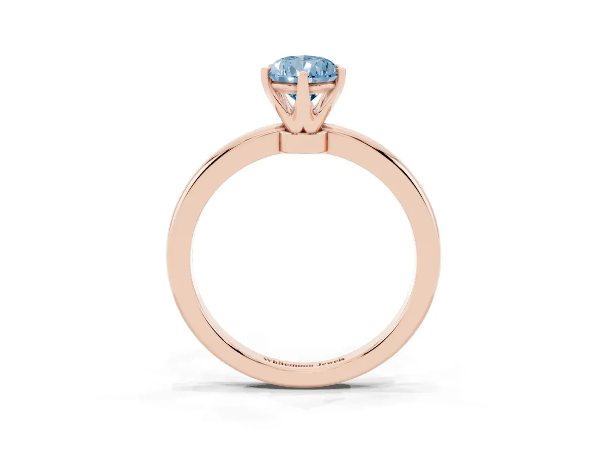 Fancy Blue Pear Cut Solitaire Diamond Ring with Six-Prong Setting on a Classic Band Rose gold