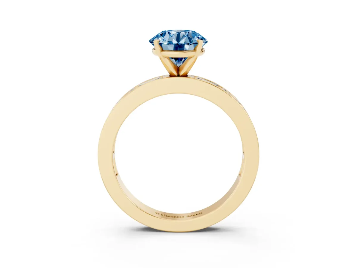 Fancy Blue Round Cut Solitaire Diamond Ring with Channel-Set Baguette Band and Four-Prong Setting Yellow gold