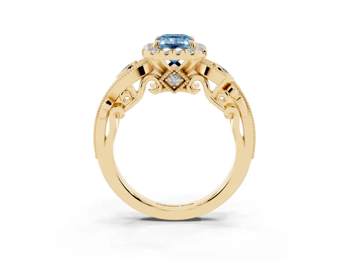Fancy Blue Emerald Cut Halo Diamond Ring with Milgrain and Bezel Accents on a Split Shank Band Yellow gold