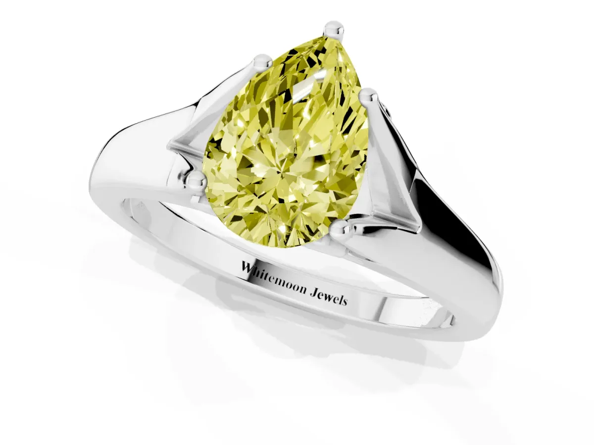 Fancy Yellow Pear Cut Solitaire Diamond Ring with Cathedral Band and Four-Prong Setting Silver