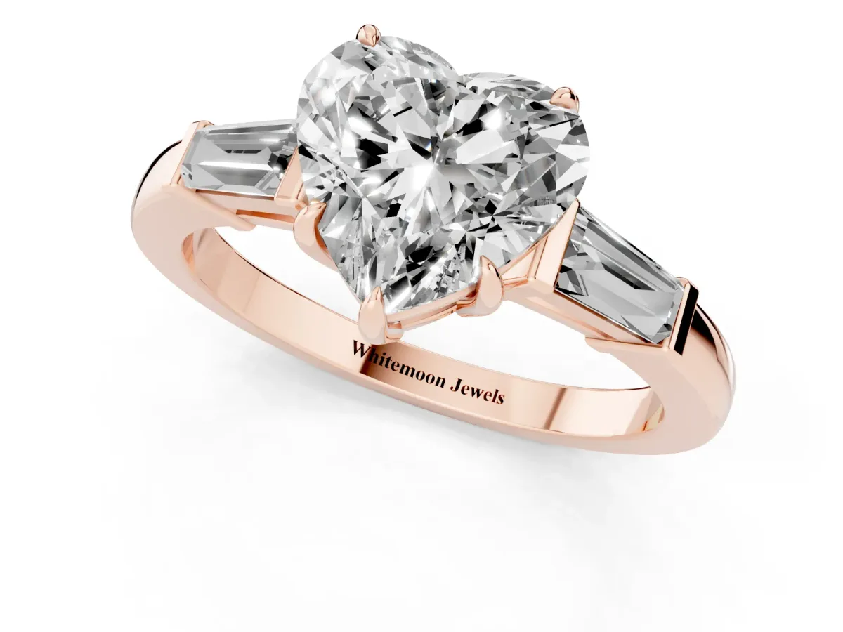 Heart Cut Diamond Three-Stone Ring with Tapered Baguette Side Stones and Prong Setting Rose gold