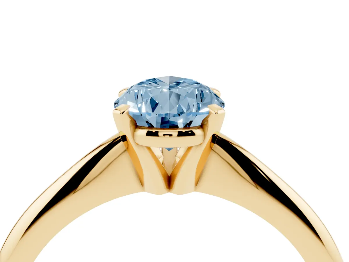 Fancy Blue Pear Cut Cut Solitaire Ring with Four-Prong Setting on a Classic Band Yellow gold