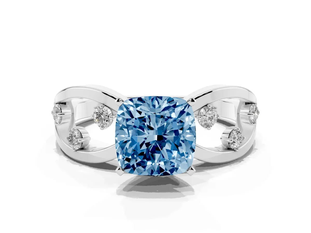 Fancy Blue Cushion Cut Cut Solitaire Diamond with Side Stones on Criss-Cross Band and Four-Prong Setting Silver