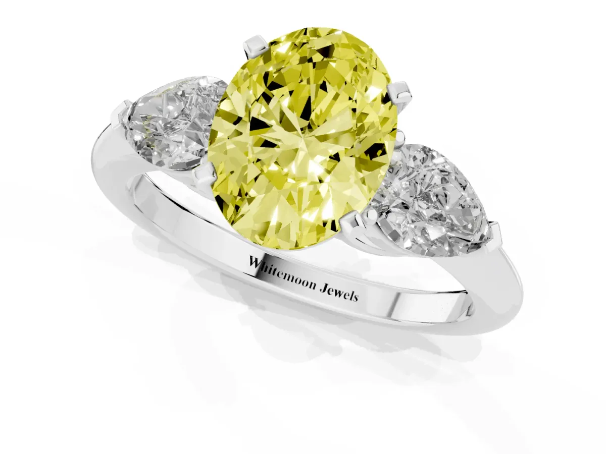 Fancy Yellow Three-Stone Oval Cut Diamond Ring with Pear Side Stones and Four-Prong Setting Platinum