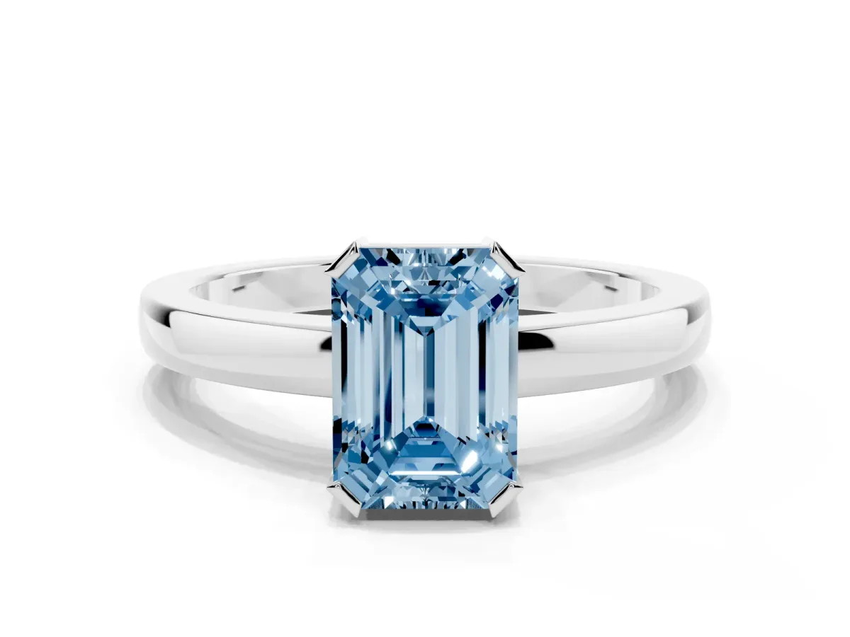Fancy Blue Emerald Cut Cut Solitaire Ring with Four-Prong Setting and Classic Band Silver