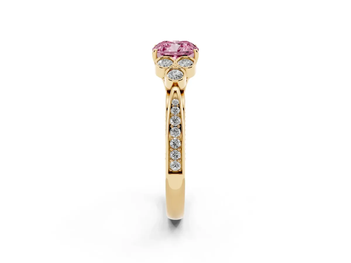 Fancy Pink Cushion Cut Cut Diamond Engagement Ring with Bezel Set Round Side Stones and Prong Setting Yellow gold
