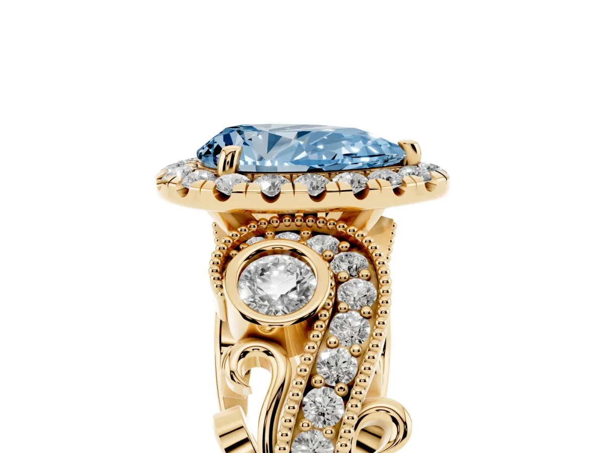 Fancy Blue Pear Cut Halo Diamond Ring with Milgrain and Bezel Accents on a Split Shank Band Yellow gold