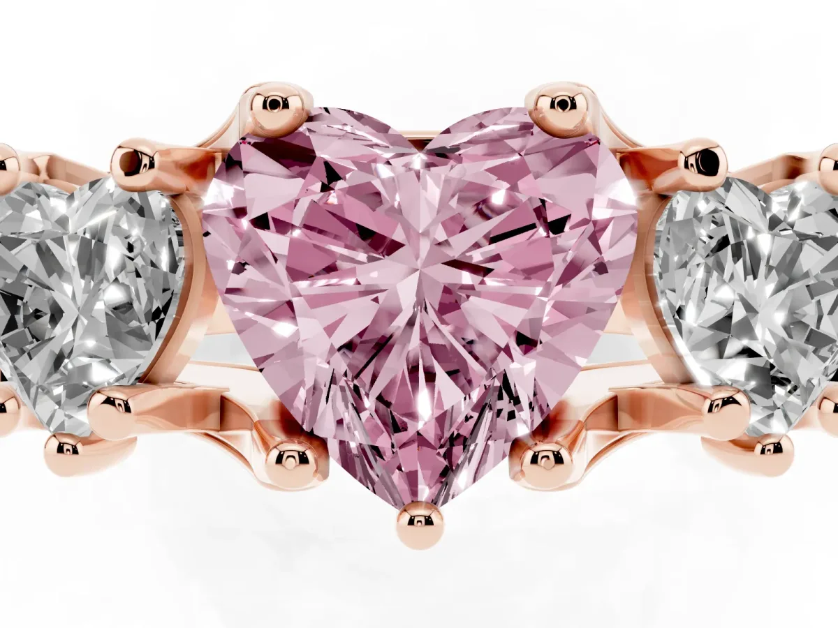 Fancy Pink Heart Cut Diamond Three-Stone Ring with Channel Set Band and Four-Prong Setting Rose gold
