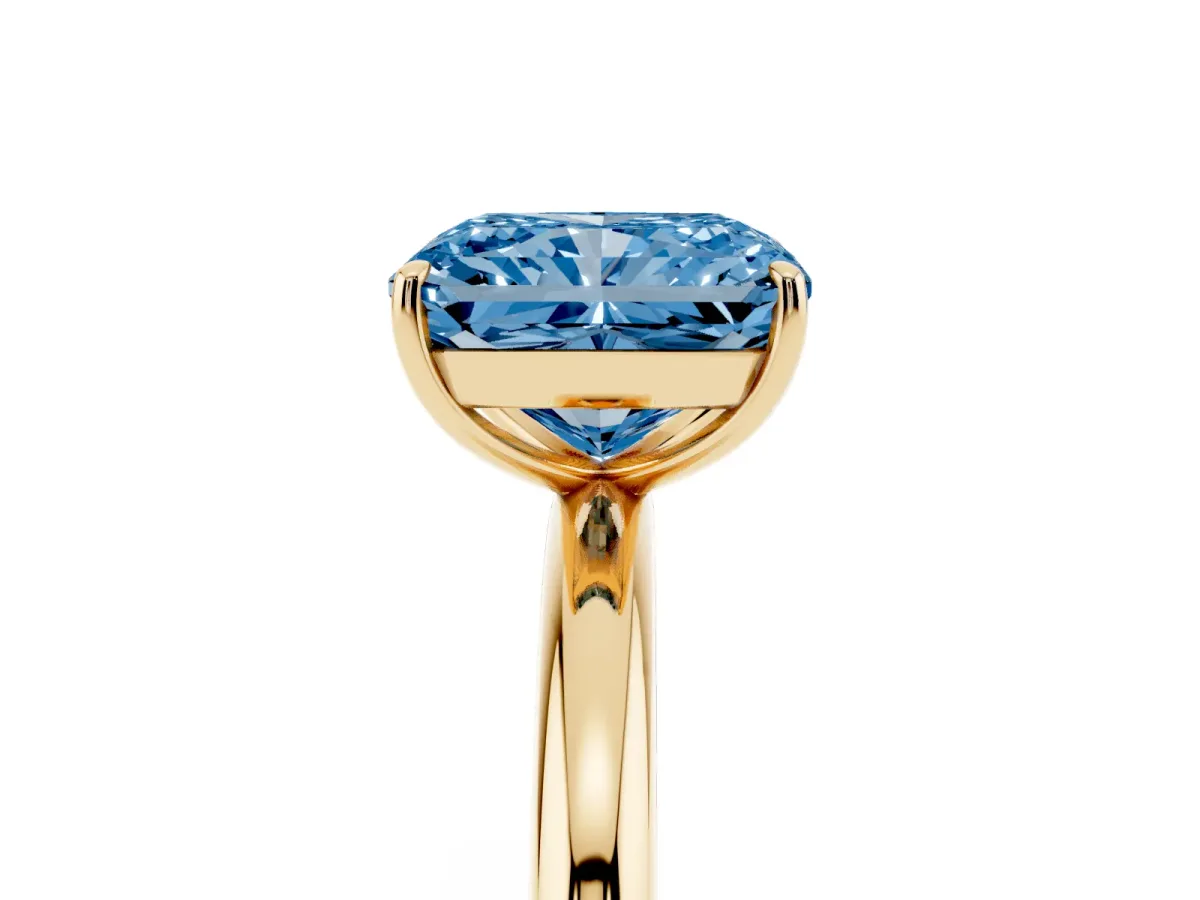 Fancy Blue Radiant Cut Solitaire Diamond Ring with Four-Prong Setting on a Plain Band Yellow gold