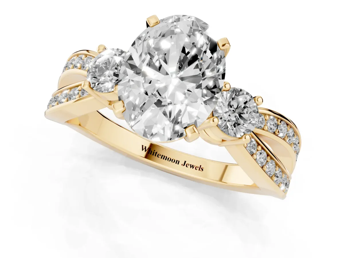 Three-Stone Oval Cut Cut Diamond Twist Band with Prong Setting Yellow gold