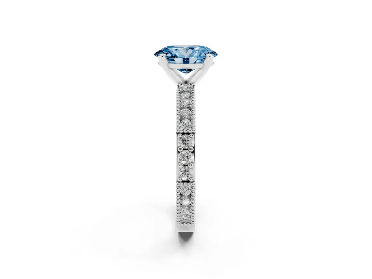 Fancy Blue Oval Cut Solitaire with Pavé Band and Four-Prong Setting Silver