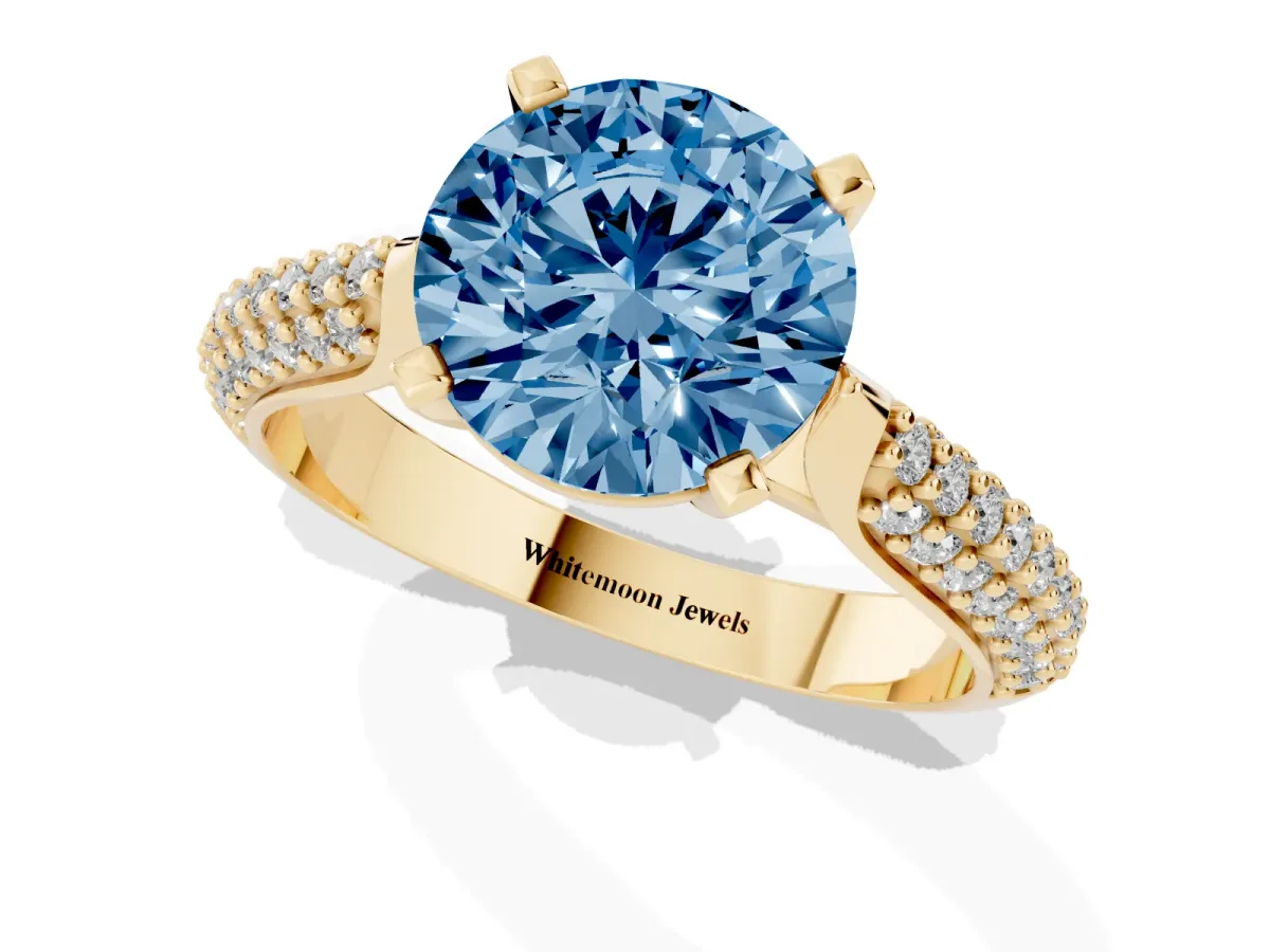 Fancy Blue Round Cut Diamond Solitaire Engagement Ring with Multi-Row Round Pavé Band and Prong Setting Yellow gold