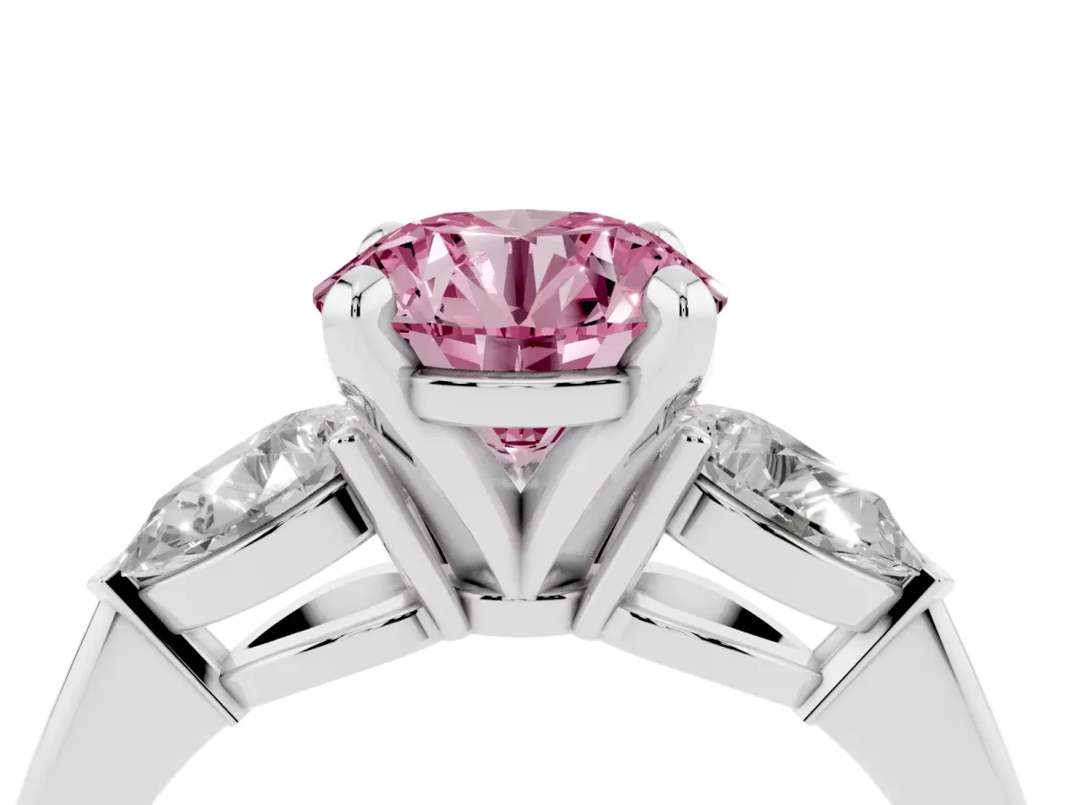 Fancy Pink Three-Stone Round Cut Diamond Ring with Pear Side Stones and Four-Prong Setting Platinum