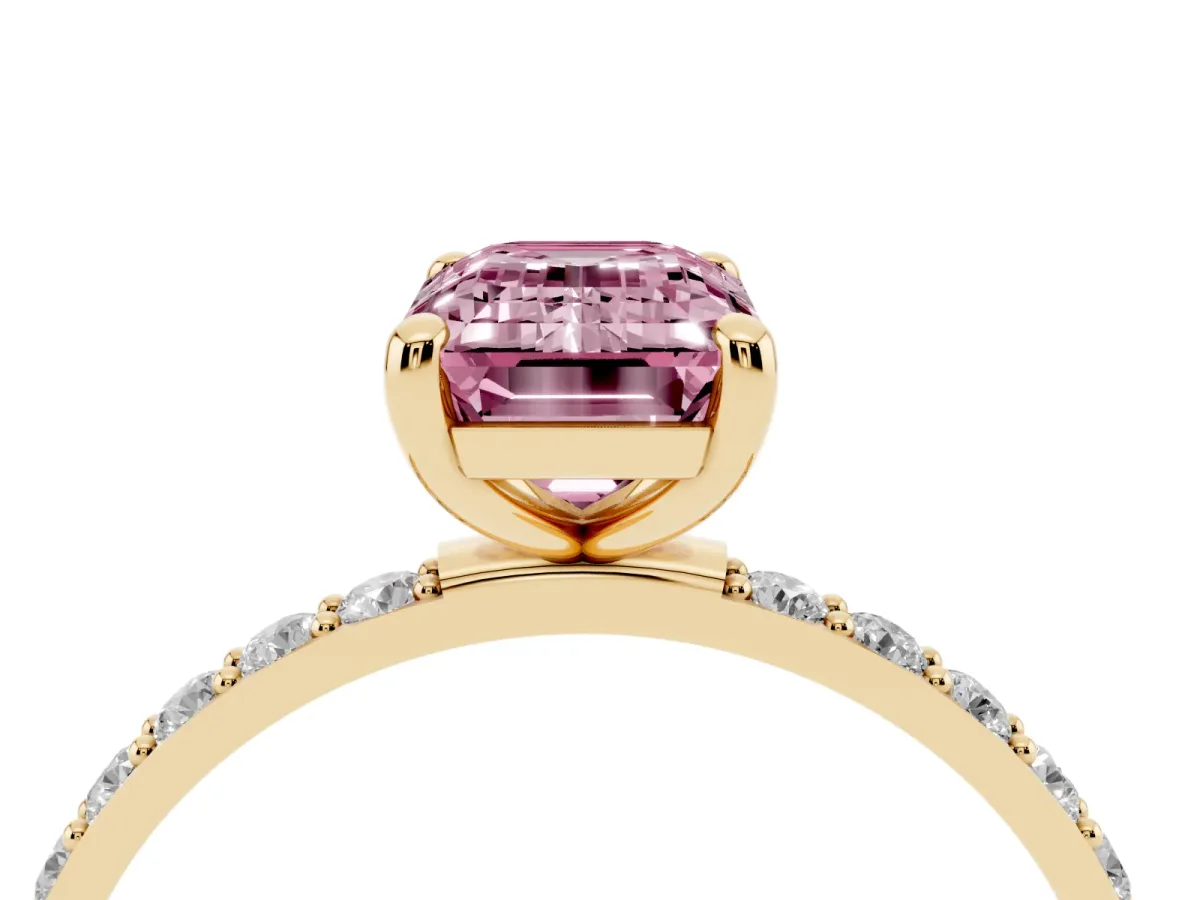 Fancy Pink Emerald Cut Diamond Solitaire Ring with Round Pavé Band and Prong Setting Yellow gold