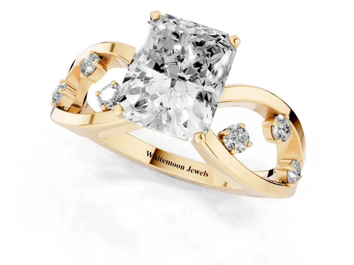 Radiant Cut Cut Solitaire Diamond with Side Stones on Criss-Cross Band and Four-Prong Setting Yellow gold