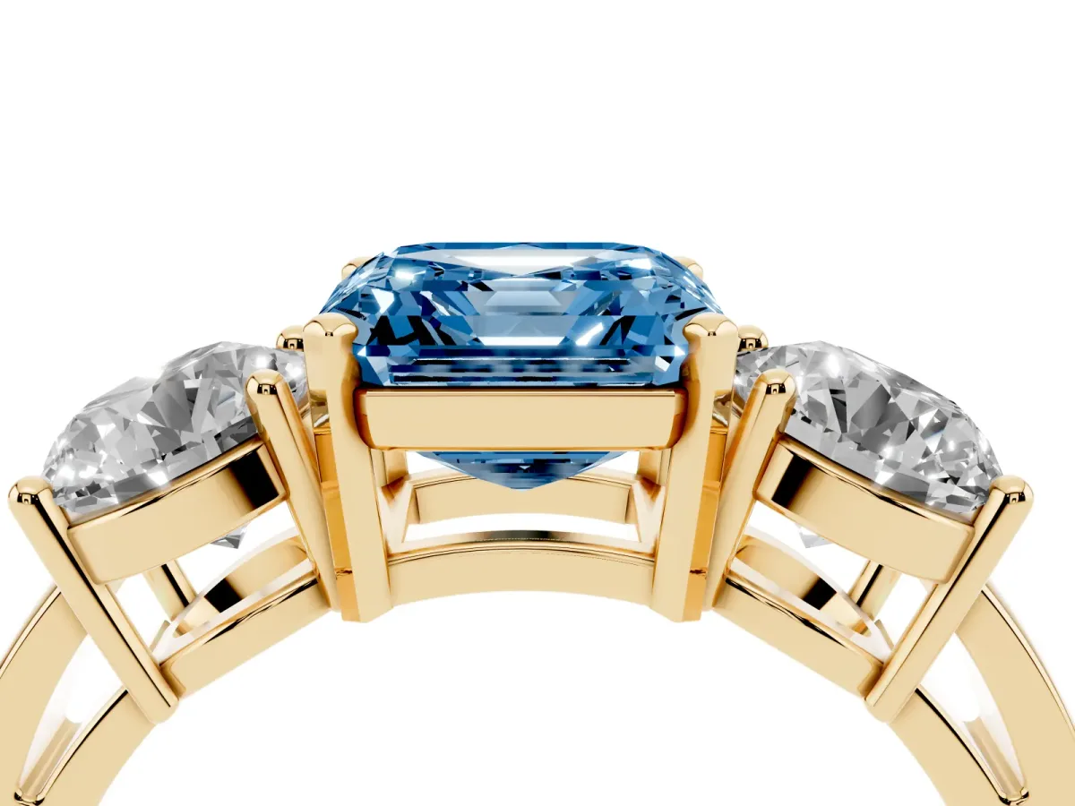 Fancy Blue Three-Stone Asscher Cut Diamond Ring with Round Side Stones, Classic Band, and Four-Prong Setting Yellow gold