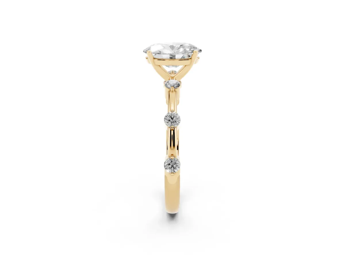 Oval Cut Solitaire Diamond Ring with Bezel Set Side Stones and Prong Setting Yellow gold