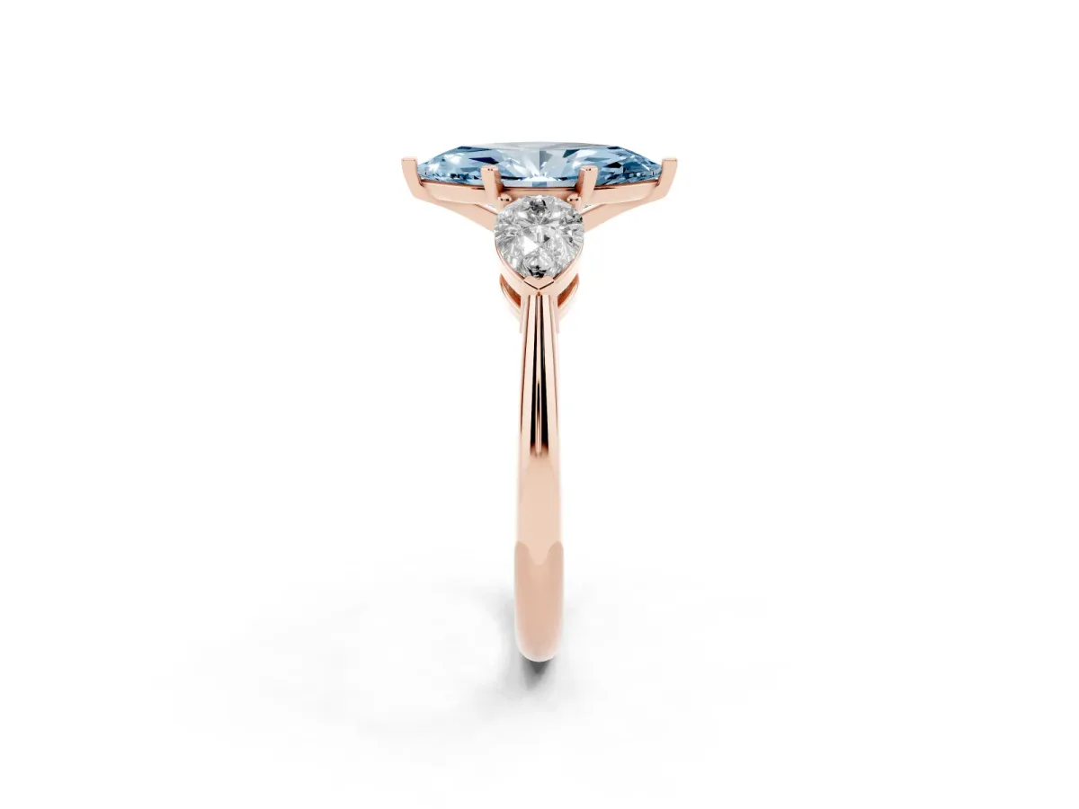 Fancy Blue Three-Stone Marquise Cut Diamond Ring with Pear Side Stones and Four-Prong Setting Rose gold