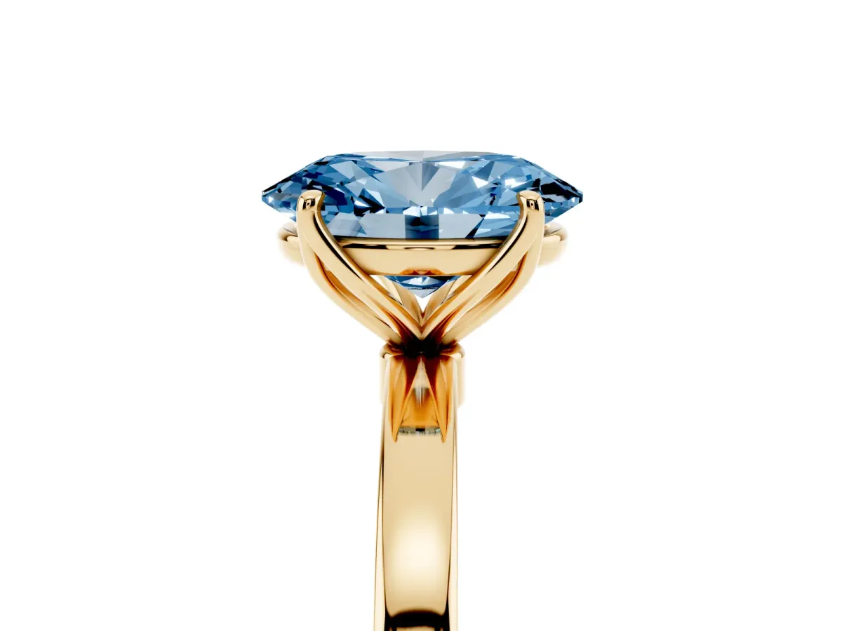 Fancy Blue Oval Cut Diamond Solitaire Ring with Thin Band and Prong Setting Yellow gold