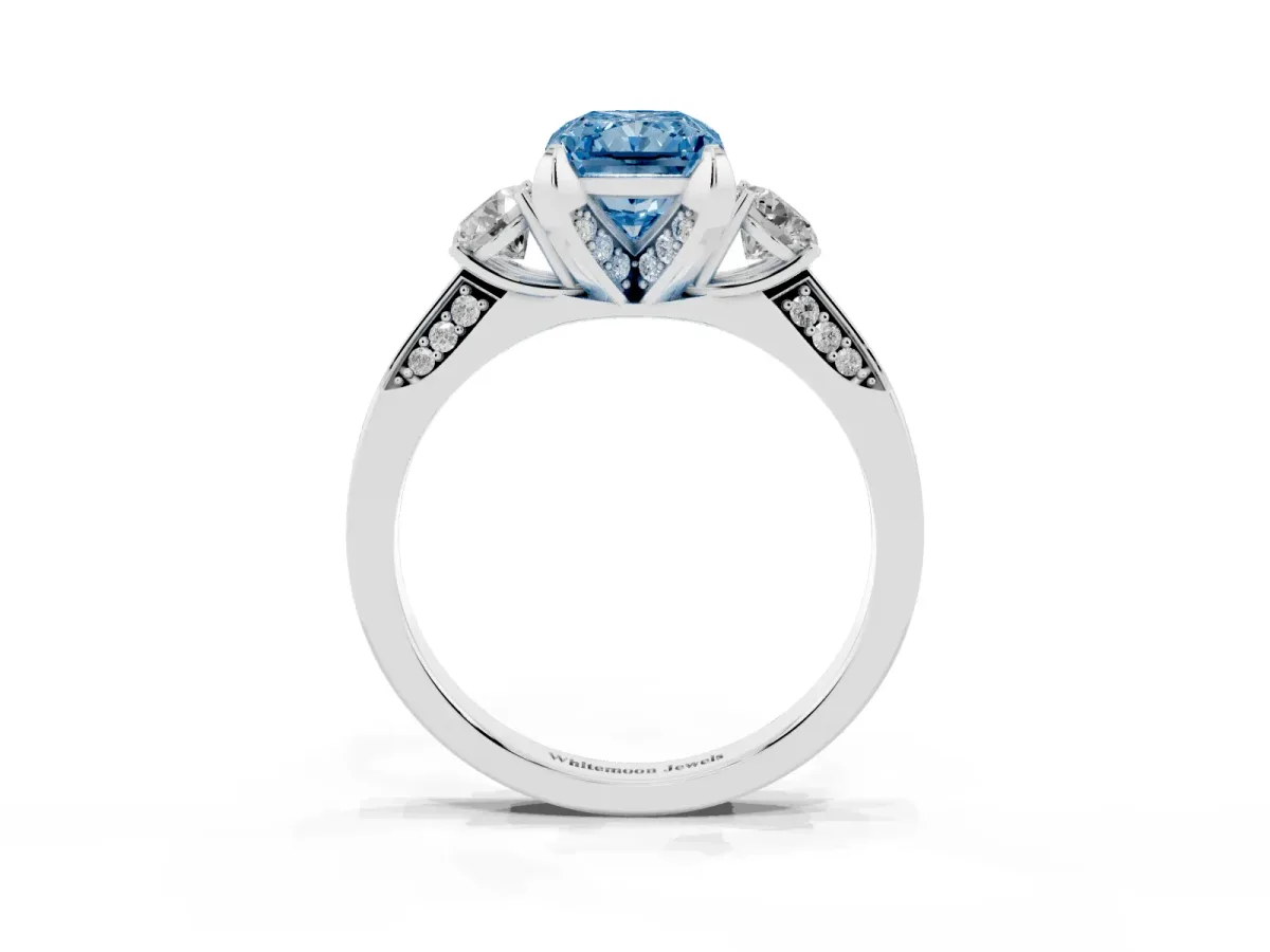 Fancy Blue Radiant Cut Brilliant Three-Stone Diamond Ring with Pavé Band and Four-Prong Setting Silver