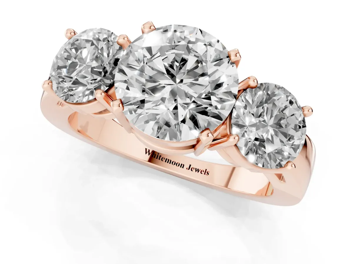 Three-Stone Round Cut Diamond Ring with Round Side Stones, Classic Band, and Four-Prong Setting Rose gold