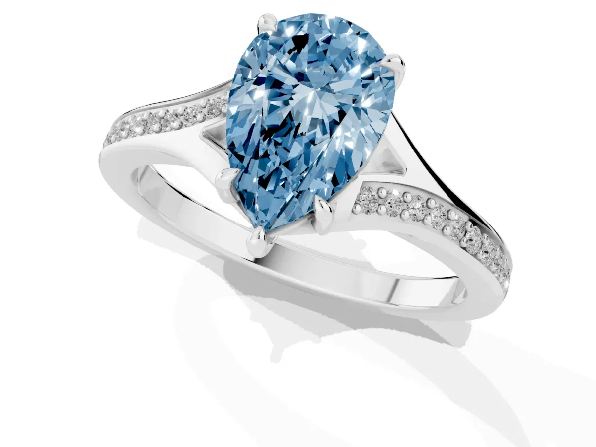 Fancy Blue Pear Cut Diamond Solitaire Ring with Pavé Band and Prong Setting Silver