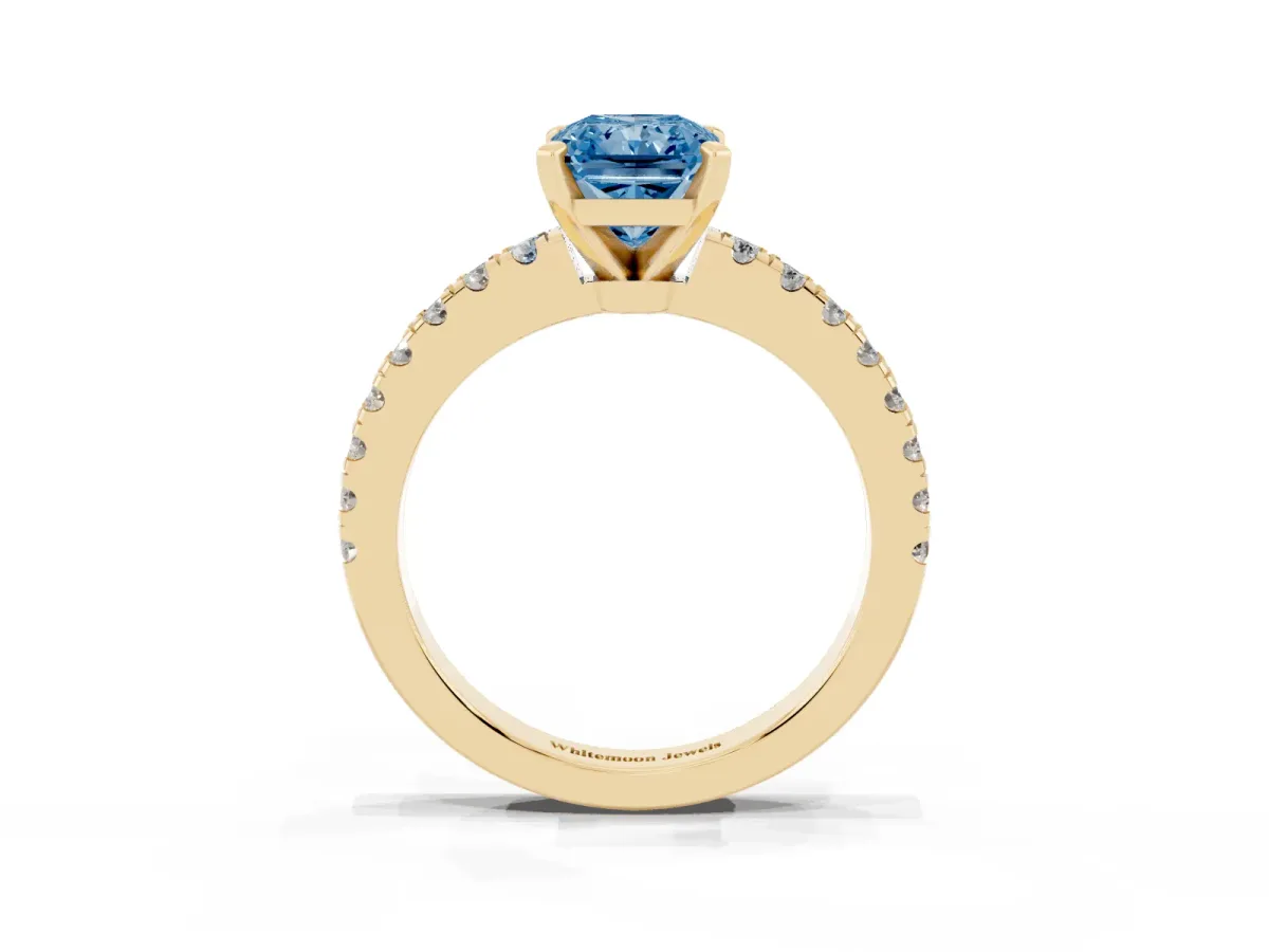 Fancy Blue Radiant Cut Solitaire Diamond with Pavé Band and Four-Prong Setting Yellow gold