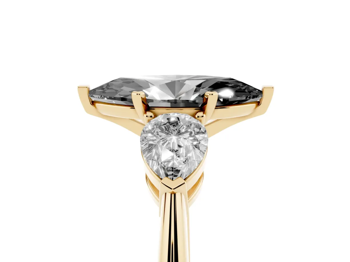 Fancy Black Three-Stone Marquise Cut Diamond Ring with Pear Side Stones and Four-Prong Setting Yellow gold