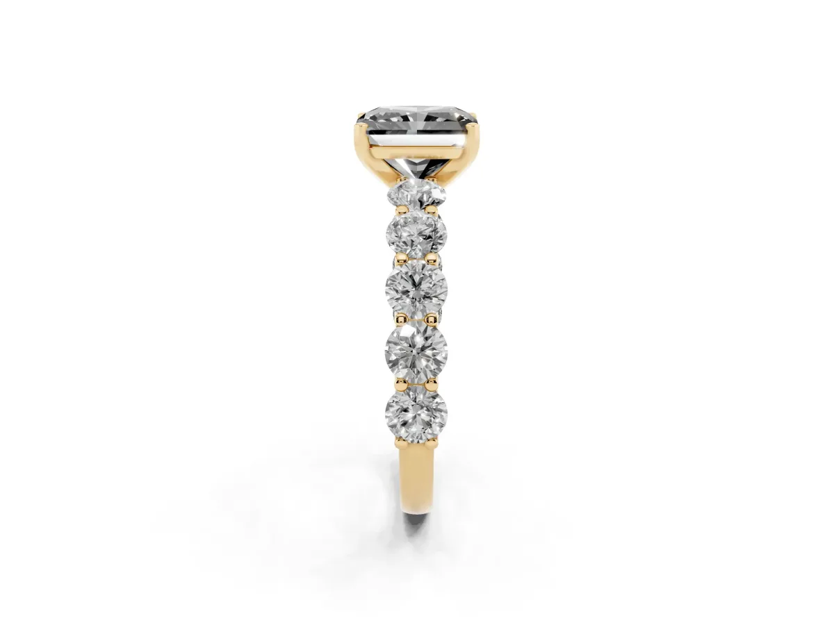 Fancy Black Radiant Cut Diamond Prong Setting with Side Stones on a Pave Band Yellow gold