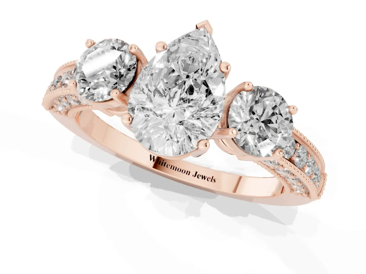 Pear Cut Three-Stone Diamond Ring with Pavé Band and Four-Prong Setting Rose gold