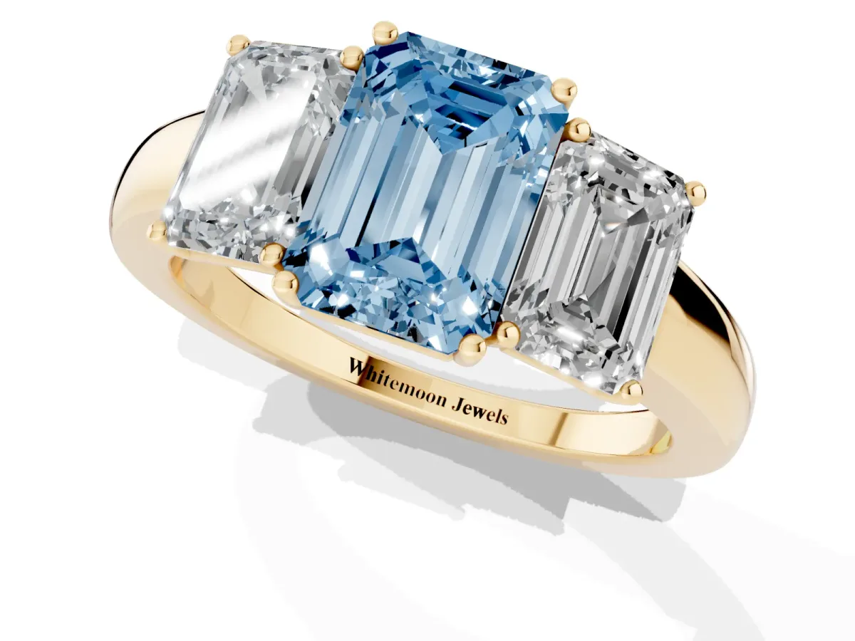 Fancy Blue Emerald Cut Diamond Three-Stone Ring with Four-Prong Setting and Classic Band Yellow gold