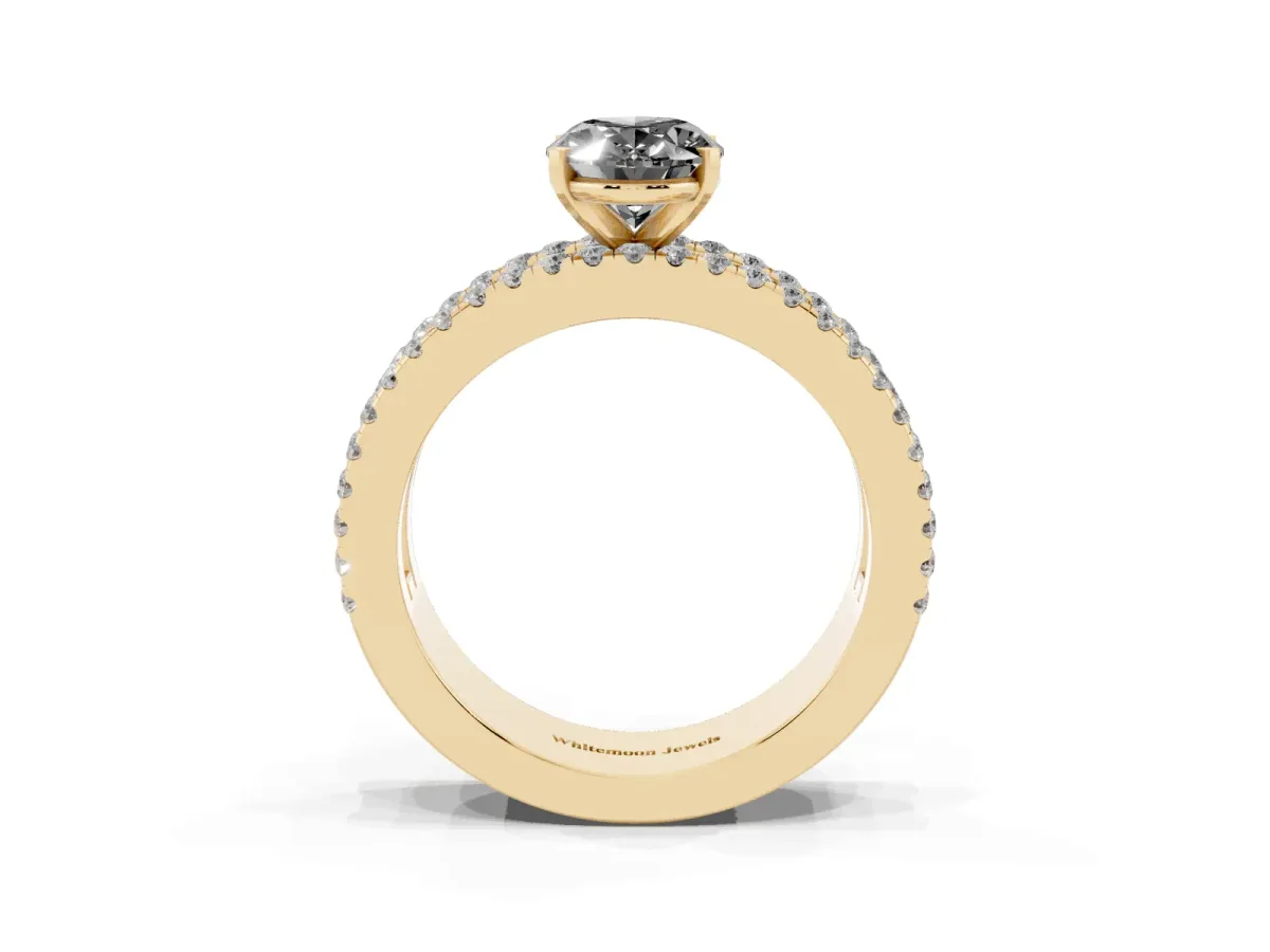 Fancy Black Oval Cut Diamond Solitaire Ring with Pavé and Channel Set Band Yellow gold