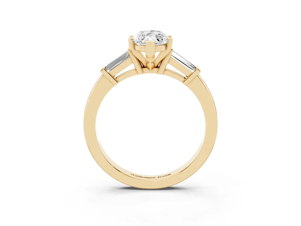 Marquise Cut Cut Diamond Solitaire Ring with Tapered Baguette Accents and Four-Prong Setting Yellow gold