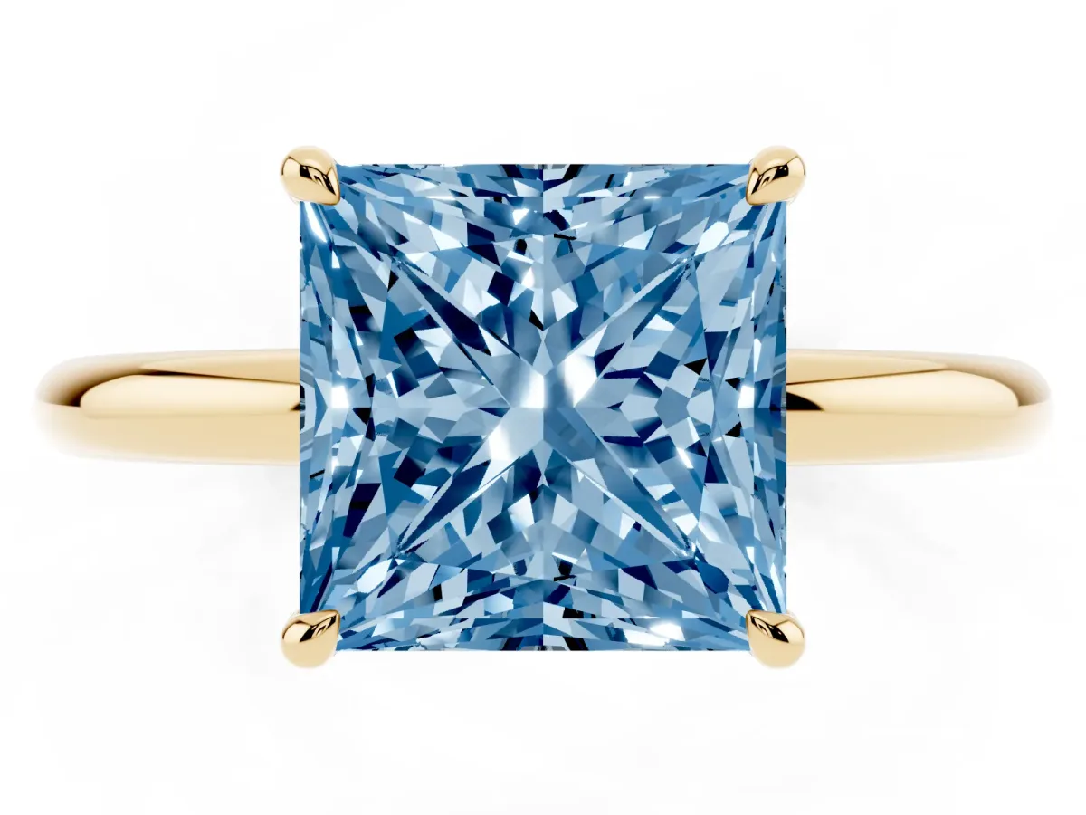 Fancy Blue Princess Cut Diamond Solitaire Ring with Thin Band and Four-Prong Setting Yellow gold