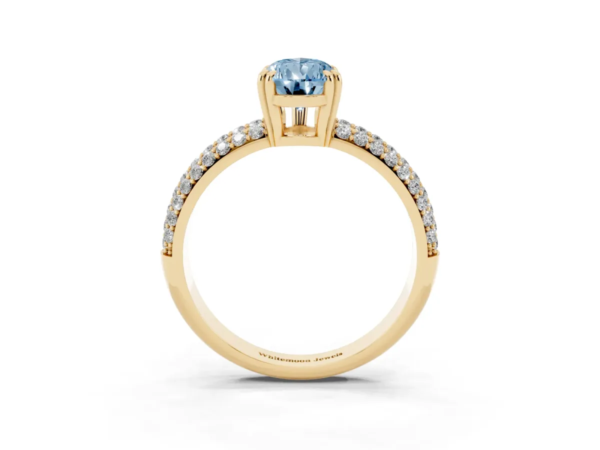 Fancy Blue Pear Cut Diamond Solitaire Ring with Multi-Row Round Pavé Band and Prong Setting Yellow gold