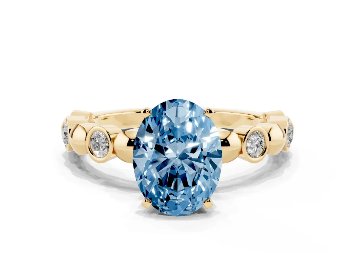 Fancy Blue Oval Cut Solitaire Bezel-Set Diamond Ring with Beaded Band and Four-Prong Setting Yellow gold