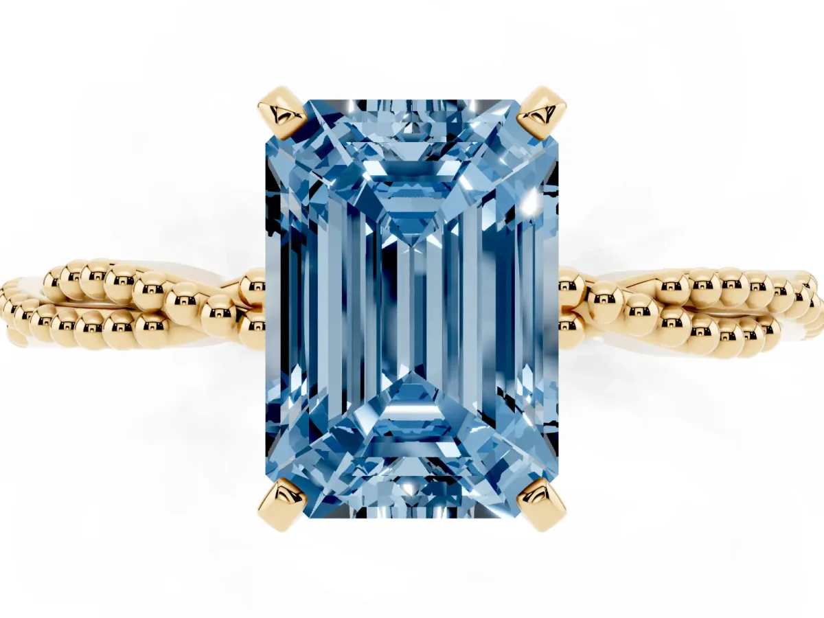 Fancy Blue Emerald Cut Solitaire Twisted Band with Bead Prong Setting Yellow gold