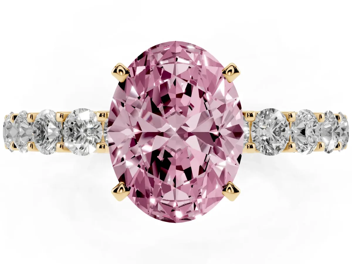 Fancy Pink Oval Cut Diamond Solitaire Ring with Shared Prong Pavé Band and Four-Prong Setting Yellow gold