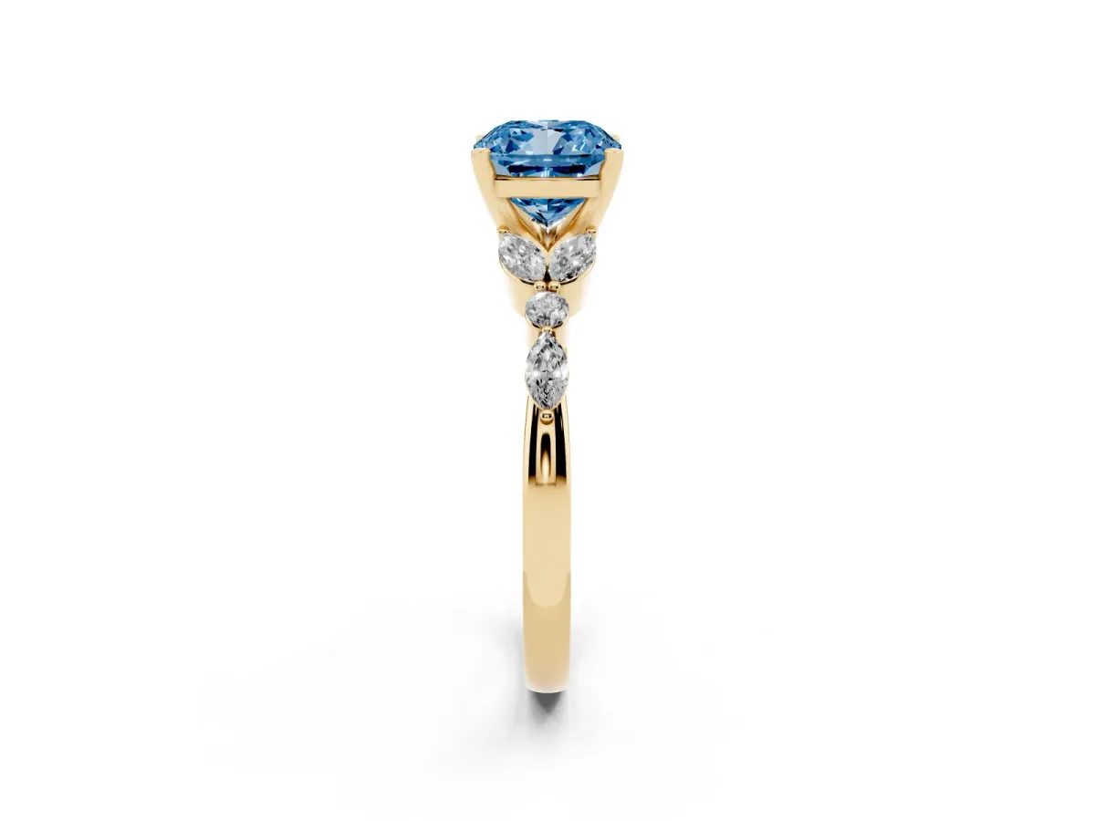 Fancy Blue Cushion Cut Diamond Solitaire Ring with Side Stones and Four-Prong Setting Yellow gold