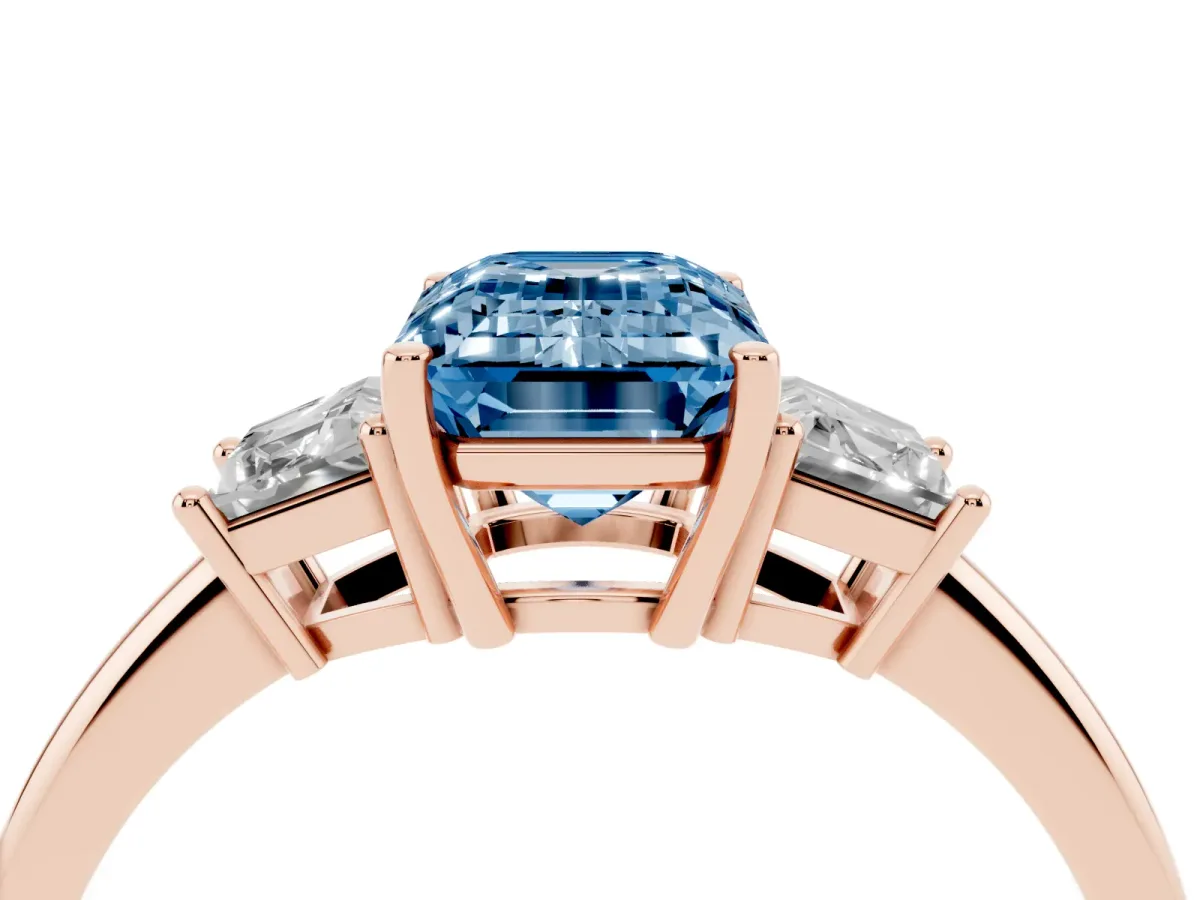 Fancy Blue Emerald Cut Diamond Three-Stone Ring with Trapezoid Side Stones and Prong Setting Rose gold