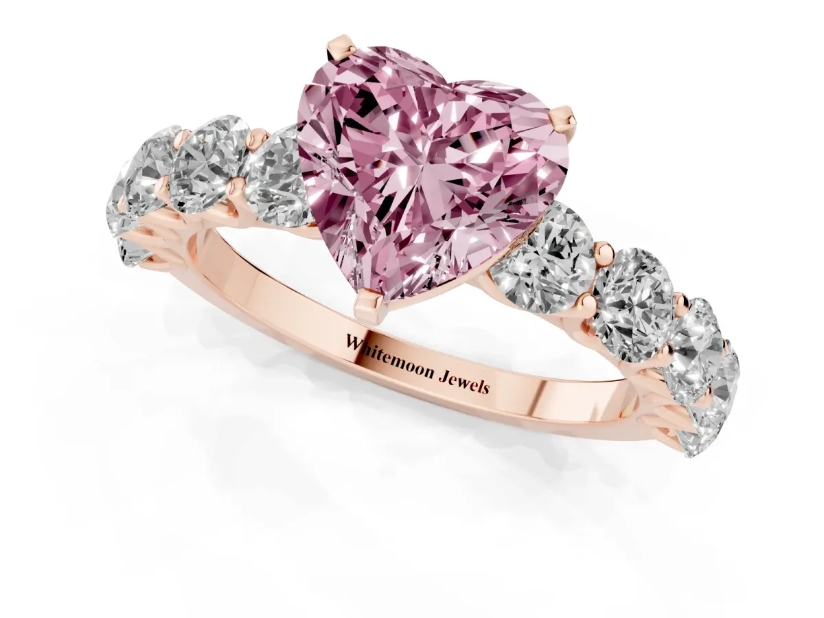 Fancy Pink Heart Cut Diamond Prong Setting with Side Stones on a Pave Band Rose gold